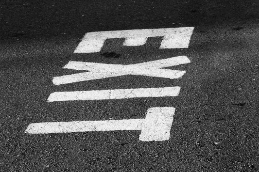 a street sign is painted on the asphalt